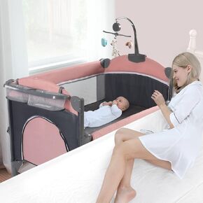 Jaoul 5 in 1 Baby Crib, Baby Bassinet Beside Sleeper, Pack and Play with Bassinet and Changing Table Portable Travel Baby Playpen with Toys & Music Box, Mattress for Girl Boy Infant Newborn Pink