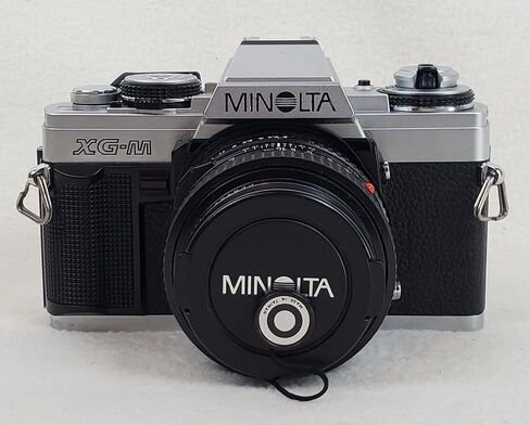 Minolta XG-M Manual Focus 35MM SLR Film Camera with Minolta MD mount Manual Focusing Zoom lens. Compatible with color and B&W film manual & auto shutter options (Renewed) in Saudi Arabia