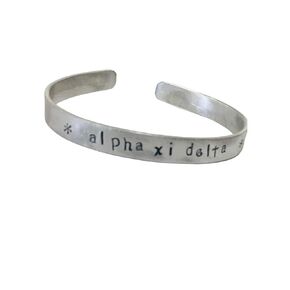 Alpha Xi Delta Cuff Bracelet, AXD jewelry - handstamped in a whimsical font on a non tarnish aluminum cuff, officially licensed