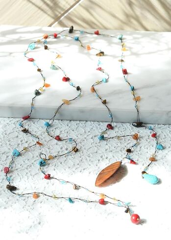 AeraVida Trendy Wrap Around Layers of Simulated Turquoise, Seashell, and Mixed Stones on Cotton Rope Lariat Style Beaded Long Necklace in Saudi Arabia