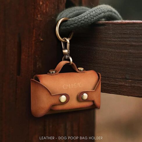 Handmade Leather Dog Poop Bag Dispenser - Stylish and Durable with Belt Attachment for Dog Walkers, Featuring a Brass Metal Clip in Hand-dyed Brown in Saudi Arabia