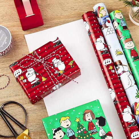 Hallmark Christmas Peanuts Wrapping Paper with Cut Lines on Reverse (Pack of 3, 105 sq. ft. ttl) Snoopy, Charlie Brown, Woodstock (5JXW1036) in Saudi Arabia