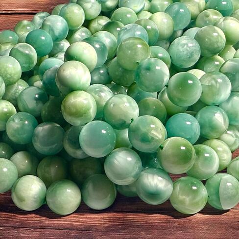 ABCGEMS Dominican Republic Larimar Beads with Black Iron Oxide Inclusion (These Hematite Inclusion Manifest as Black Streaks Providing a Striking Contrast) Smooth Round 12mm in Saudi Arabia