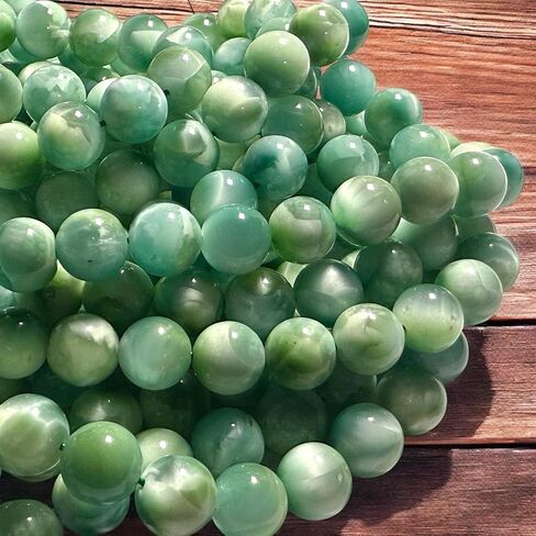 ABCGEMS Dominican Republic Larimar Beads with Black Iron Oxide Inclusion (These Hematite Inclusion Manifest as Black Streaks Providing a Striking Contrast) Smooth Round 12mm in Saudi Arabia