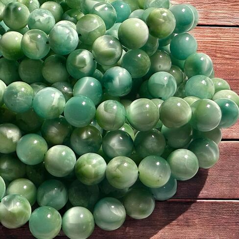 ABCGEMS Dominican Republic Larimar Beads with Black Iron Oxide Inclusion (These Hematite Inclusion Manifest as Black Streaks Providing a Striking Contrast) Smooth Round 12mm in Saudi Arabia