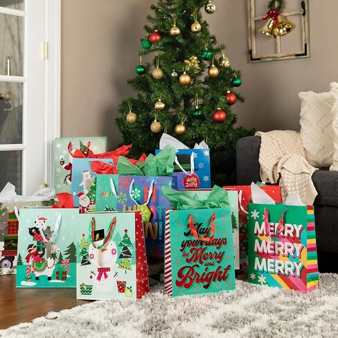 Christmas Gift Bags Medium Size Bulk-24 Charming Christmas Designs- Holiday Gift Bags with Colored Christmas Tissue Paper and Gift Tags-Christmas Goody Bags with Ribbon Handles -Foil Stamped Xmas Bags in Saudi Arabia