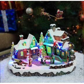 Christmas Village Centerpiece Decor, Santa Riding Sleigh Flying Over The Town Center, with Christmas Tree, featuring LED Lights, Christmas Music, and Animation - Power Adapter (included)