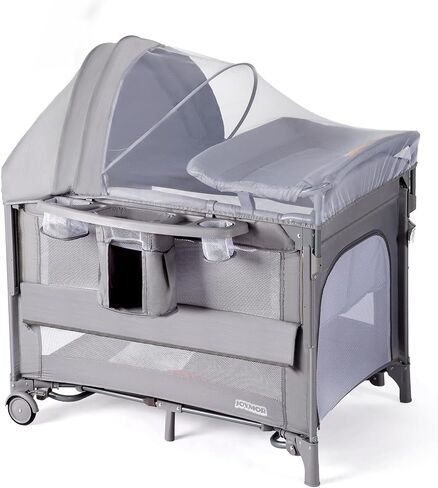 JOYMOR 9 in 1 Bedside Bassinet with Changing Table, Pack and Play with Bassinet, Convert to Rocking Baby Bed with Electric Music Center, Mosquito Net, Toy, Storage,Pink in Saudi Arabia