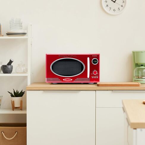 Nostalgia Retro Microwave Oven 0.7 Cu Ft, 700-Watt Countertop Size with Glass Turntable, Child Safety Lock, 8 Auto-Cook Programs, Digital Clock, Pink in Saudi Arabia
