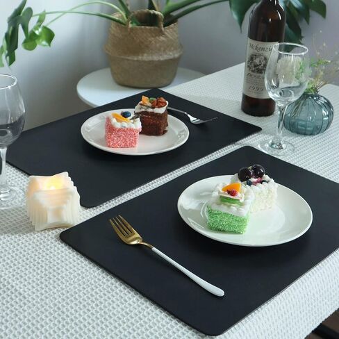 Vinjiasin Placemats Set of 4 Black Leather Place Mats Waterproof Wipeable Heat Resistant Sturdy Rectangle Kitchen Dining Table Mats for Indoor Outdoor Reversible Easy to Clean Decorations in Saudi Arabia