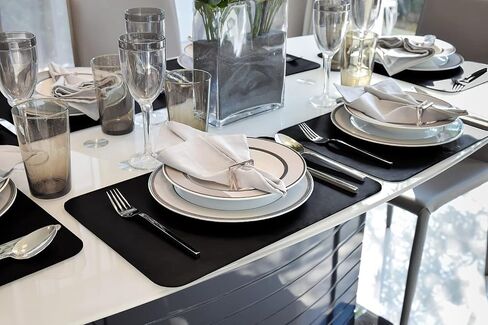 Vinjiasin Placemats Set of 4 Black Leather Place Mats Waterproof Wipeable Heat Resistant Sturdy Rectangle Kitchen Dining Table Mats for Indoor Outdoor Reversible Easy to Clean Decorations in Saudi Arabia