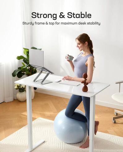 Marsail Glass Electric Standing Desk with Drawer, 48 x 24 Inches Height-Adjustable Desk, One-Piece Tempered Glass Top, Ergonomic Home Office Sit Stand Desk with 4 Preset Heights, Black in Saudi Arabia