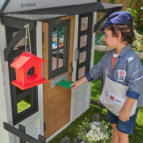 KidKraft Riverscape Wooden Playhouse with Working Doorbell, Fence, Kitchen and Pet Door in Kuwait