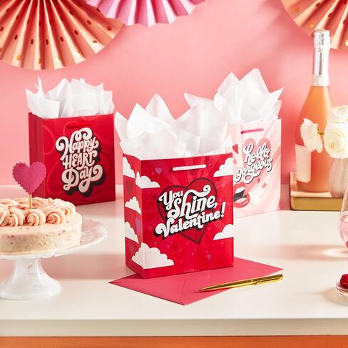 Hallmark 8" Medium Valentine's Day Gift Bags with Tissue Paper (3 Bags: Red with Black, Pink, White Stripes and Hearts) in Kuwait