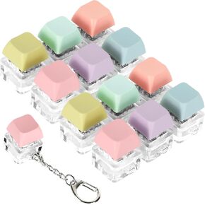Whaline 12pcs لوحة المفاتيح Toys 6 ألوان الباستيل سلاسل مفاتيح لوحة المفاتيح الإجهاد مفاتيح الإجهاد مفاتيح مفاتيح مفتاح إلغاء الضغط على حقائب اليد على ظهره.
