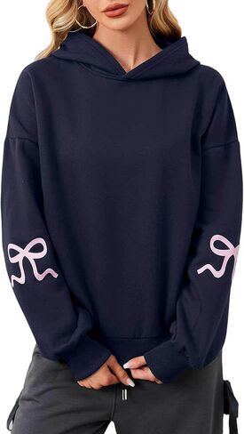 OLAPTA Women Oversized Bow Trim Print Hoodies Long Sleeve Fleeced Casual Graphic Pullover Trendy Fall Hooded Sweatshirts Top in Saudi Arabia