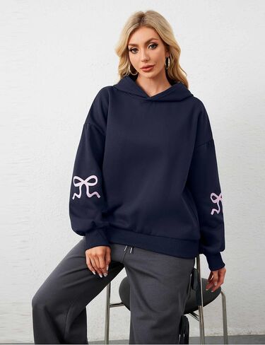 OLAPTA Women Oversized Bow Trim Print Hoodies Long Sleeve Fleeced Casual Graphic Pullover Trendy Fall Hooded Sweatshirts Top in Saudi Arabia