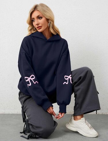OLAPTA Women Oversized Bow Trim Print Hoodies Long Sleeve Fleeced Casual Graphic Pullover Trendy Fall Hooded Sweatshirts Top in Saudi Arabia