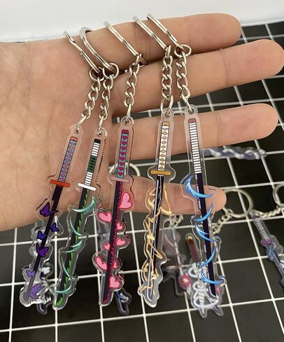 سلاسل مفاتيح الأنيمي ، سلسلة مفاتيح أنيمي أكريليك 12pc ، سلسلة مفاتيح 9pcs المعدنية Katana ، مجموعة Rengoku Sword Keychain Merch in Saudi Arabia