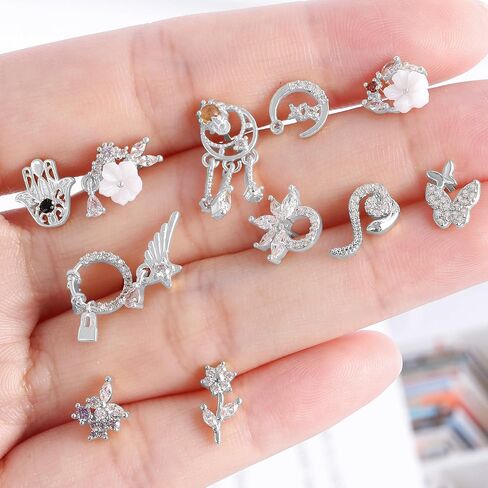 Akeoqi 16pc Dangle Dangle Rings & Buds - Felet Lape Lape و Cz Butterfly ، زهرة ، القمر ، الأفعى ، القلب والأجنحة كوكب متدلي بالأنف مجوهرات للنساء والرجال (20G) نغمة ذهبية فضية in Saudi Arabia