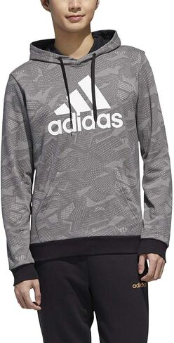 adidas male essentials all over print hoodie in Saudi Arabia