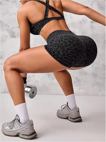 Women's 2 Piece Leopard Print Athletic Outfits Criss Cross Sports Bra and Biker Shorts Gym Tracksuits in Saudi Arabia