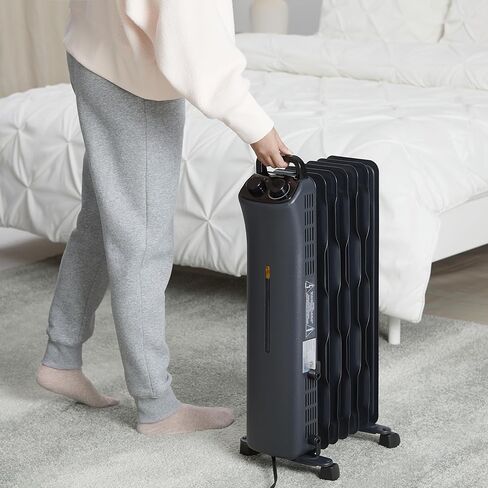 Amazon Basics Portable Radiator Heater with 7 Wavy Fins, Manual Control, Black, 1500W, 13.1 x 26.3 x 9.8 in in Saudi Arabia