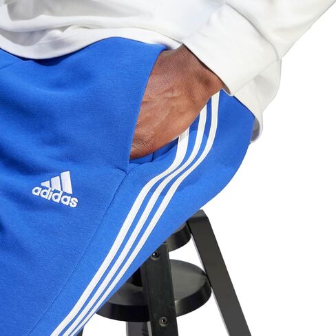 adidas Men's Essentials Fleece Tapered Cuffed 3-Stripes Pants, Black/White, Small in Saudi Arabia