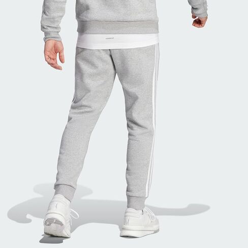 adidas Men's Essentials Fleece Tapered Cuffed 3-Stripes Pants, Black/White, Small in Saudi Arabia