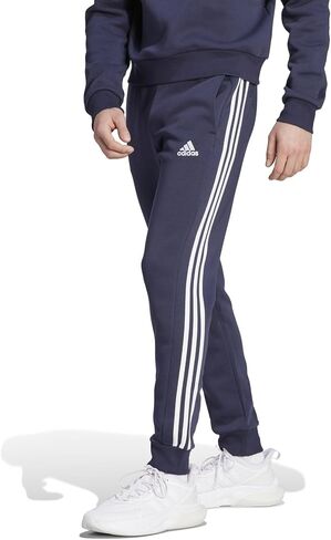 adidas Men's Essentials Fleece Tapered Cuffed 3-Stripes Pants, Black/White, Small in Saudi Arabia