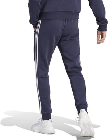 adidas Men's Essentials Fleece Tapered Cuffed 3-Stripes Pants, Black/White, Small in Saudi Arabia