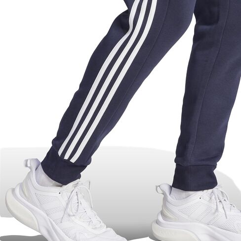 adidas Men's Essentials Fleece Tapered Cuffed 3-Stripes Pants, Black/White, Small in Saudi Arabia