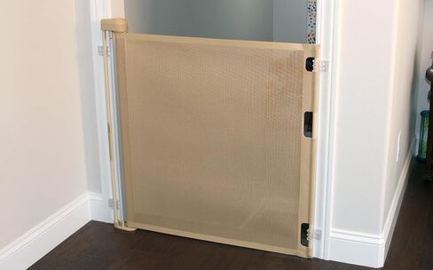 Retract-A-Gate 52 Inch White Retractable Baby and Dog Gate, Made in USA | The original certified retractable gate for top & bottom stairs; 200lb push-out force, angled installs, wide, tall, & sleek in Saudi Arabia