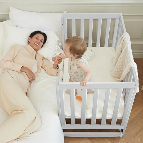 EvoNest Baby Crib, 6 in 1 Convertible Mini Crib with Wheels, 100% New Zealand Pinewood Growing Bed, 4 Adjustable Mattress Height， White in Saudi Arabia