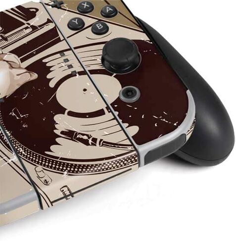 Skinit Decal Gaming Skin Compatible with Nintendo Switch OLED (2021) - DJ Spinning Design in Saudi Arabia