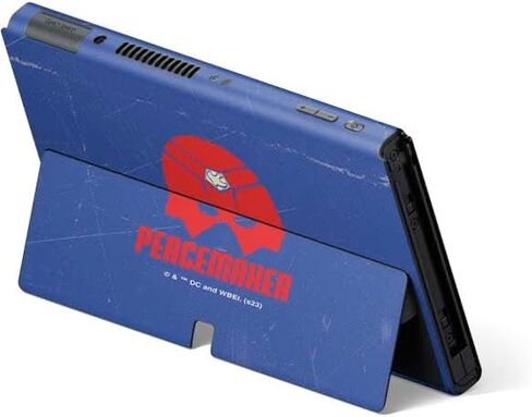Skinit Decal Gaming Skin Compatible with Nintendo Switch OLED (2021) - Officially Licensed DC Comics Peacemaker Collage Design in Saudi Arabia