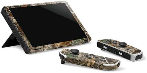 Skinit Decal Gaming Skin Compatible with Nintendo Switch OLED (2021) - Officially Licensed Realtree WAV3 Blue Camo Design in Saudi Arabia