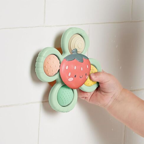 Itzy Ritzy Fidget Toy with Sensory Poppers & Suction Cup; Fidget Toy Sticks to Highchairs, Tables or Tubs While Spinning & Engaging Baby with 4 Textured Poppers, Smile in Saudi Arabia