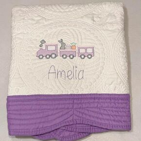 Custom Easter Bunny Train Embroidered Heirloom Quilt Blankets - Personalized with your choice of name and thread color. Border color options: pink, blue, white, green & purple.