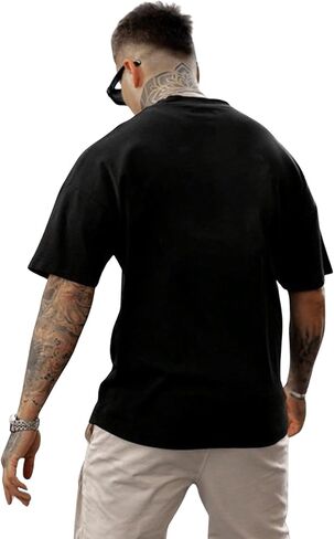 تي شيرت رجالي من SweatyRocks برسوم جرافيك وأكمام قصيرة ورقبة دائرية وكتف منسدل in Kuwait