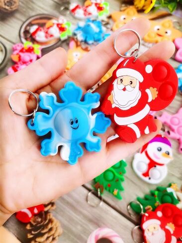 30 Packs Snata Bulk Mini pop Christmas Fidget Gifts for School Holiday Kids Party Favors and Classroom Students Prizes in Saudi Arabia