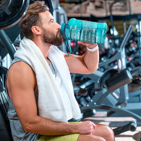 زجاجة مياه HydroMATE من NatureWorks سعة نصف جالون مع أوقات للشرب، خالية من مادة BPA، إبريق قابل لإعادة الاستخدام ومضاد للتسرب مع مقبض، 64 أونصة in Kuwait