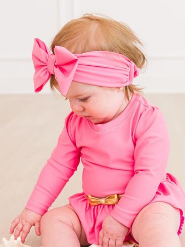 RuffleButts Girls UPF50+ Shimmer Swim Bow Headband in Saudi Arabia