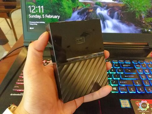 القرص الصلب الخارجي المحمول ماي باسبورت سعة 6 تيرابايت من ويسترن ديجيتال، أسود، يتضمن برنامج نسخ احتياطي مع حماية ضد برامج الفدية وحماية كلمة المرور، متوافق مع USB 3.1/USB 3.0 - WDBR9S0060BBK-WESN in Kuwait