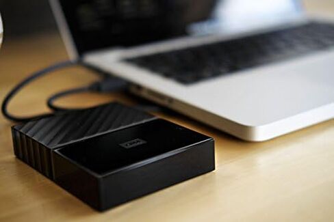 القرص الصلب الخارجي المحمول ماي باسبورت سعة 6 تيرابايت من ويسترن ديجيتال، أسود، يتضمن برنامج نسخ احتياطي مع حماية ضد برامج الفدية وحماية كلمة المرور، متوافق مع USB 3.1/USB 3.0 - WDBR9S0060BBK-WESN in Kuwait