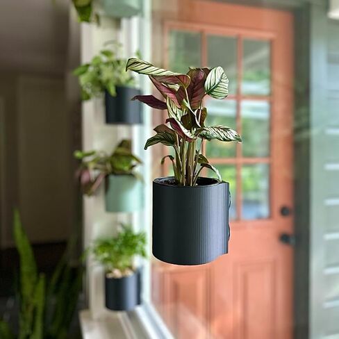| The original Suction Planter | Hangs on tile, window, drywall, fridge, etc. | Self-watering and draining | Holds 4" nursery pot | 3D printed (Matte Black, 3 Pack) in Saudi Arabia