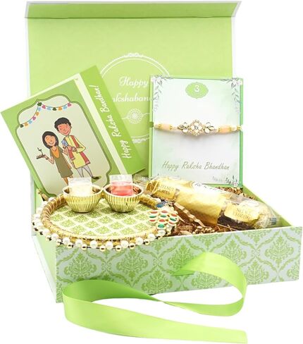 Rakhi Giftbox | Carming Rakhi Giftbox مع Rakhi الجميلة ، Choco ، Pooja Thali ، Roli Chawal وبطاقة تحية مكتوبة قبل | مجموعة الهدايا راخي in Kuwait
