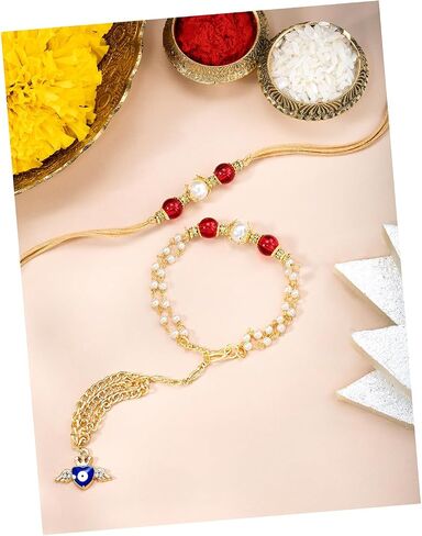 Aheli Maroon & Gold Color Rakhi & Lumba لـ Bhaiya & Bhabhi Pearl مرصع Raksha Bandhan Rakhi مع بطاقة تحية (Combo ، Pack of 2) in Saudi Arabia