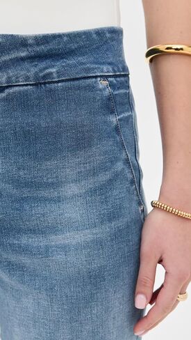Alice + Olivia Quinn's High Rise Bootcut Jeans in Saudi Arabia