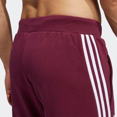 adidas x peloton joggers (الجنس المحايد) للرجال ، بورجوندي ، الحجم l in Saudi Arabia